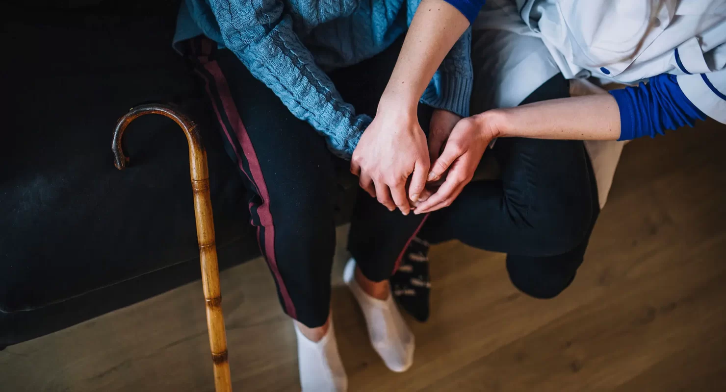 retirement-home-concept-with-nurse-and-woman-holding-hands