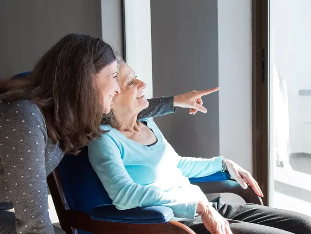 senior-care-positive-mother-daughter-enjoying-dramatic-view